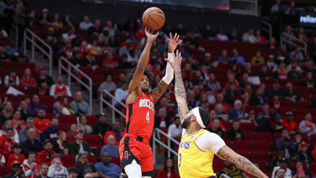 Rockets guard Jalen Green (4) shoots the ball as Los Angeles Lakers forward Anthony Davis (3) defends during the first quarter at Toyota Center.